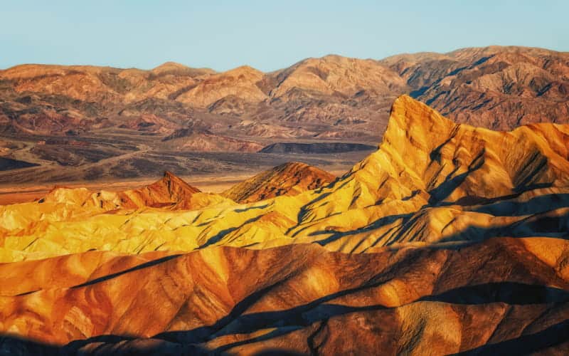 Manly Beacon in sunrise via Zabriskie Point Death Valley