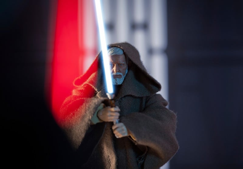 Obi-Wan holding his lightsaber