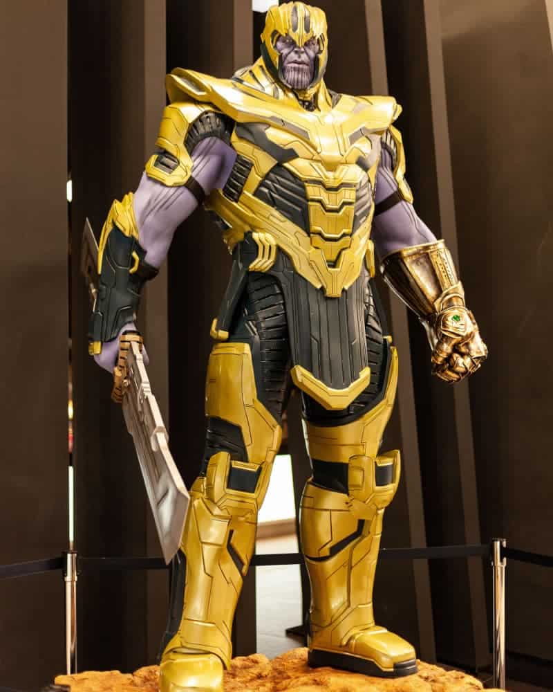 Thanos standing with his double edged sword