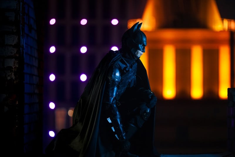 Batman sitting in the wall at night