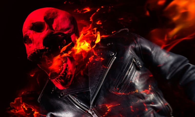 Ghost Rider in black leather biker jacket engulfed in flames standing and screaming fire