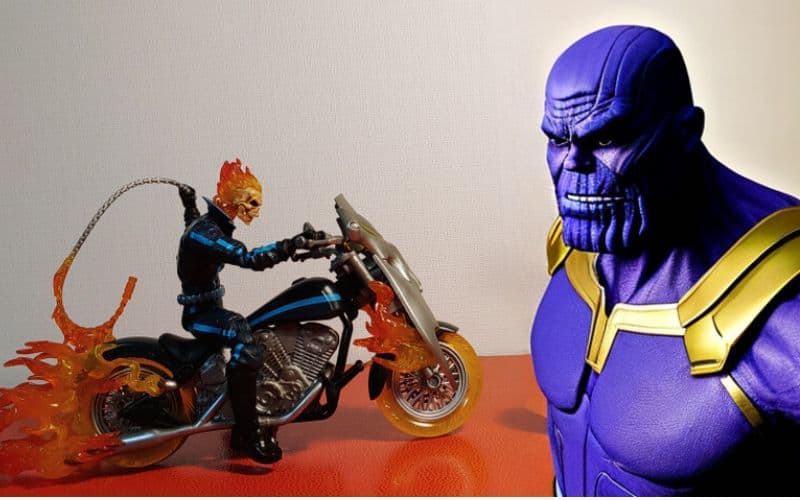 Ghost Rider riding his hellcycle vs Thanos
