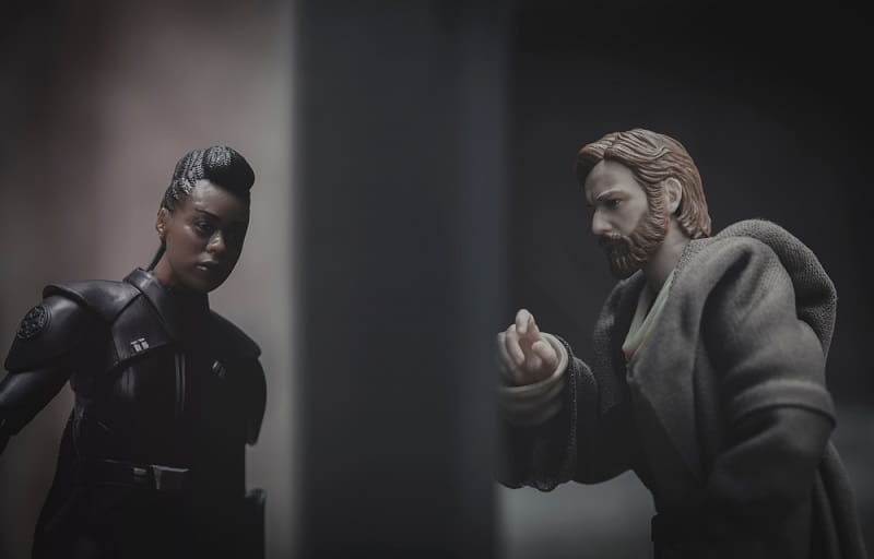 recreation of a scene from Disney Plus Star Wars series Obi-wan Kenobi and Inquisitor Third Sister Reva speak through a door