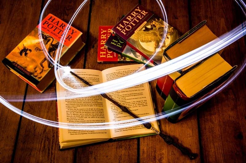 Harry Potter books using a light with long exposure to make it seem the wand is real