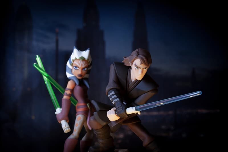 a scene from Star Wars The Clone Wars showing Jedi Anakin Skywalker and his padawan Ahsoka Tano with lightsabers drawn ready for action